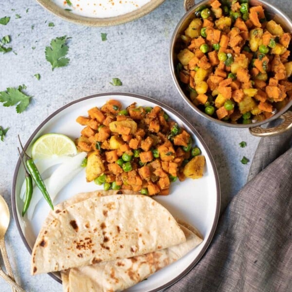 Aloo Gajar Matar served with roti and salad