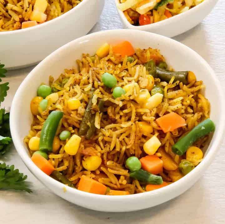 Masale Bhat, rice with vegetables in a white bowl