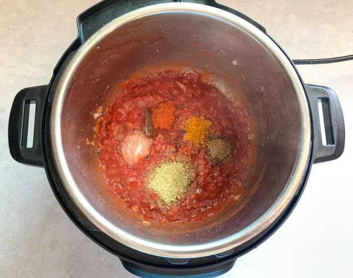 Vegetable Korma in Instant Pot Step 3- Piping Pot Curry Tomato and spices cooking in an instant pot