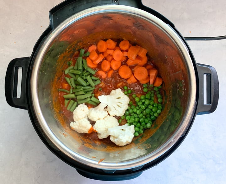 Vegetable Korma in Instant Pot Step 5 - Piping Pot Curry Variety of veggies added to a curry base in instant pot