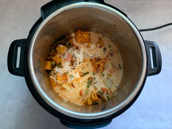 Vegetable Korma in Instant Pot Step 6- Piping Pot Curry Coconut milk added to a curry in instant pot