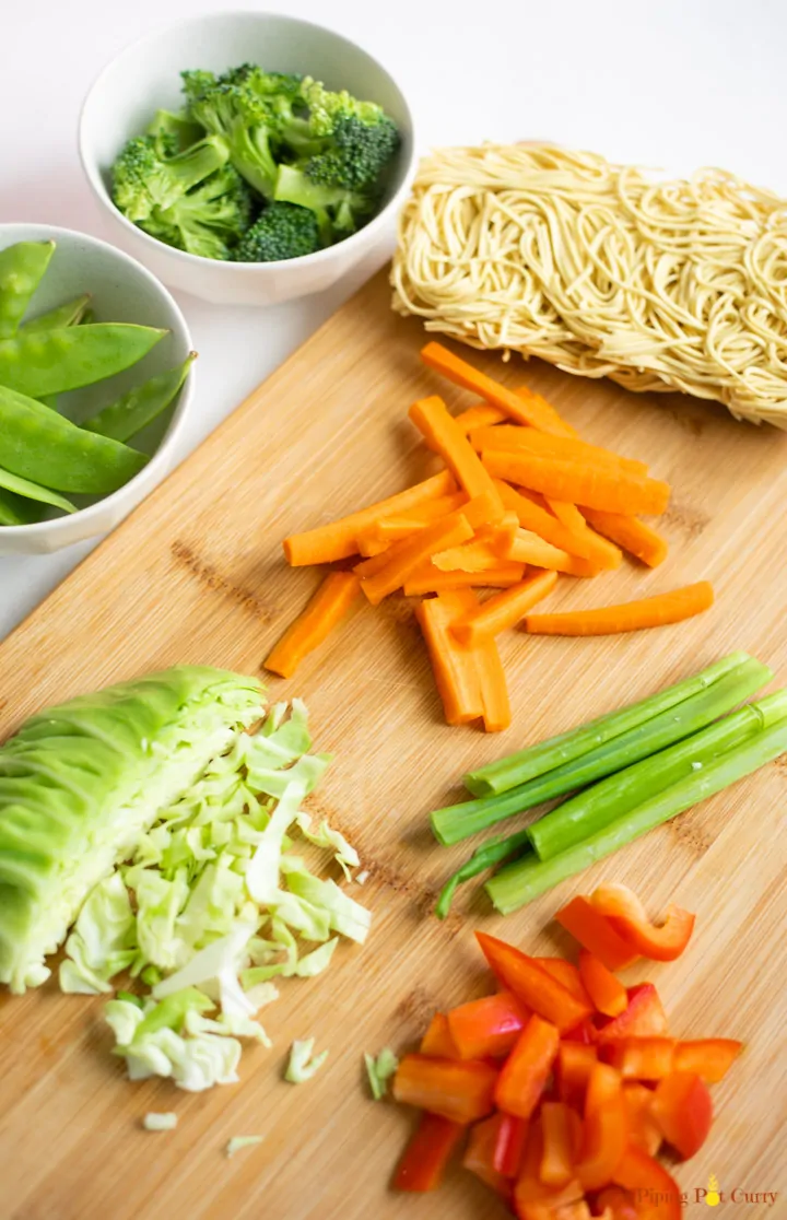 ingredients for Instant Pot vegetable Lo Mein on a cutting board