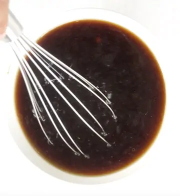 Chinese Sauces being whisked in a white bowl