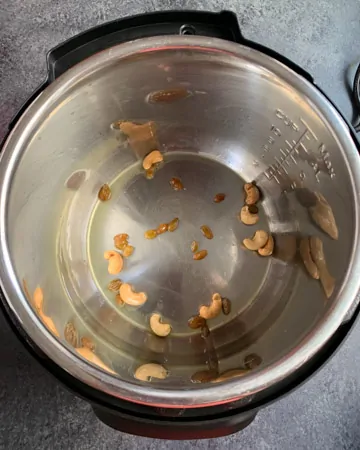 Saute cashews and raisins in instant pot