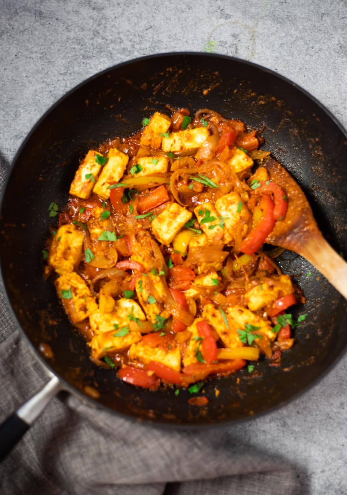 Paneer jalfrezi with peppers in a large pan