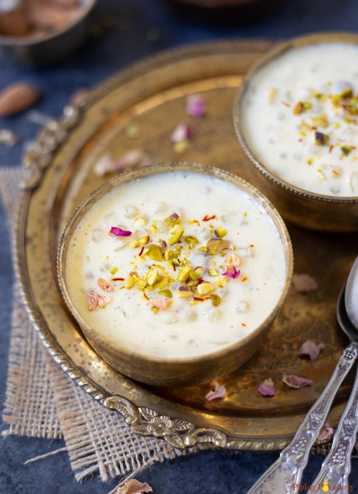 Sabudana Kheer in two bowls garnished with nuts and rose petals