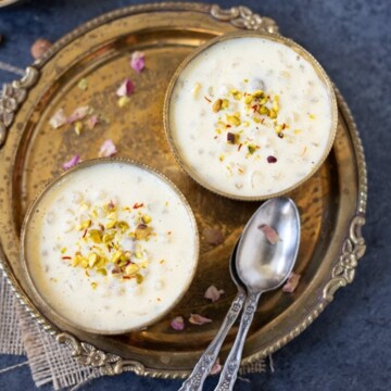 Sabudana Kheer in two bowls garnished with nuts and rose petals