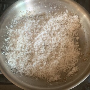 grated coconut in a pan