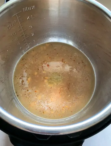 Water with brown wheat in a pressure cooker