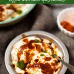 Dahi Bhalla Chaat - Lentil fritters in a bowl topped with yogurt and chutneys
