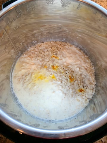 Cooked rolled oats with saffron and milk in pressure cooker