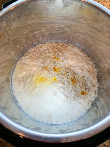 Cooked rolled oats with saffron and milk in pressure cooker