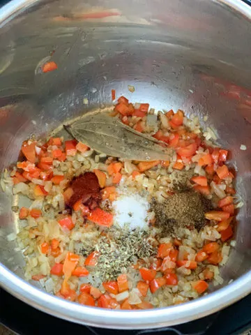 Bell pepper, onions and spices in pressure cooker