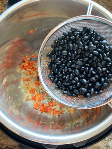 Add black beans to cook in the instant pot