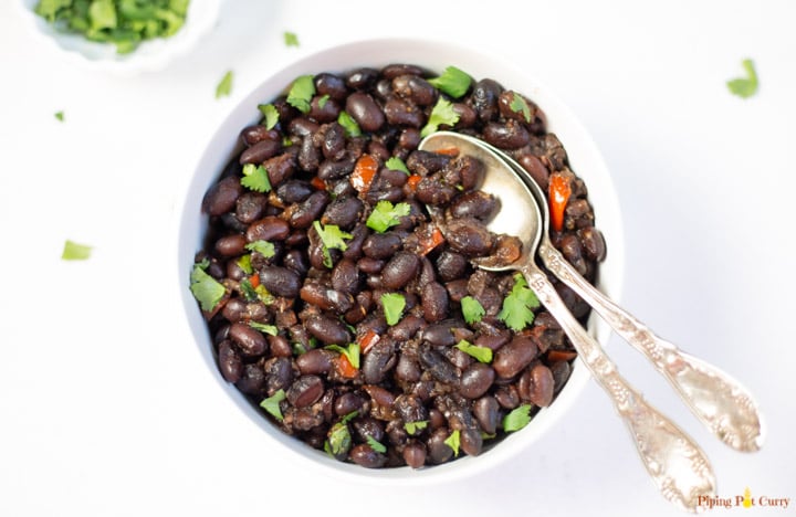 black beans in a bowl garnished with cilantro 