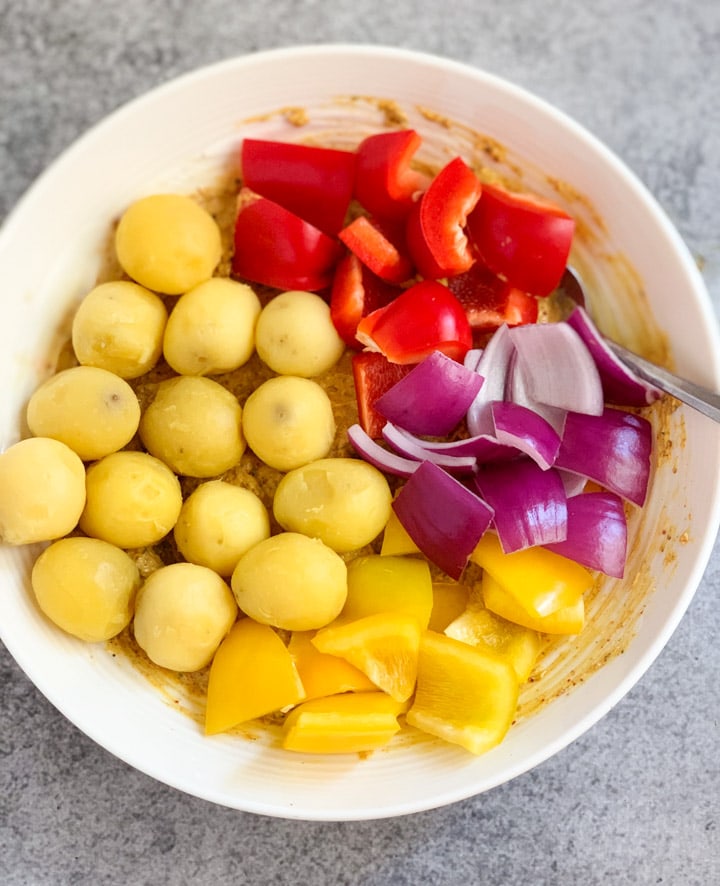 Tandoori Aloo Tikka Steps - Piping Pot Curry Potatoes, bell peppers and onions in a marinade