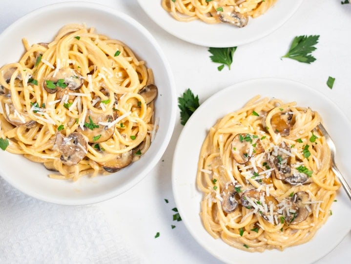 Mushroom Spaghetti in 2 white bowls