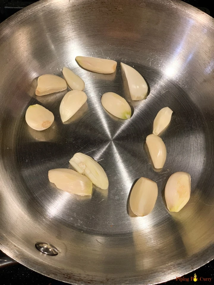1. Roasting garlic for Dry garlic chutney - Piping Pot Curry Roasting garlic in a pan