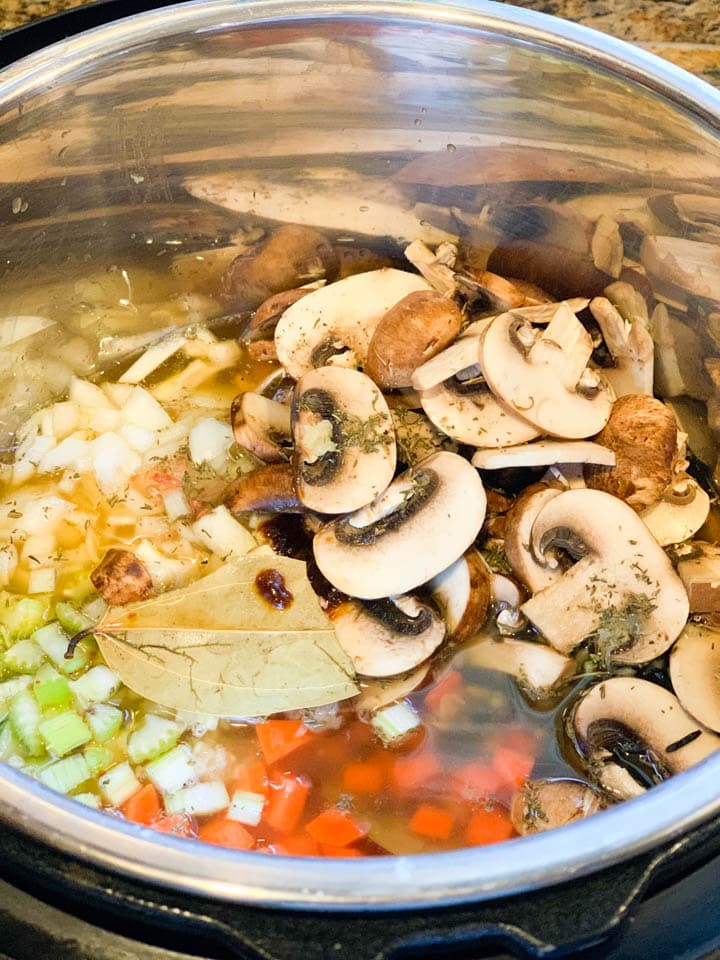 Dump and go Mushroom Wild Rice Soup - Piping Pot Curry Ingredients for soup such as mushroom, carrots, onions in the instant pot