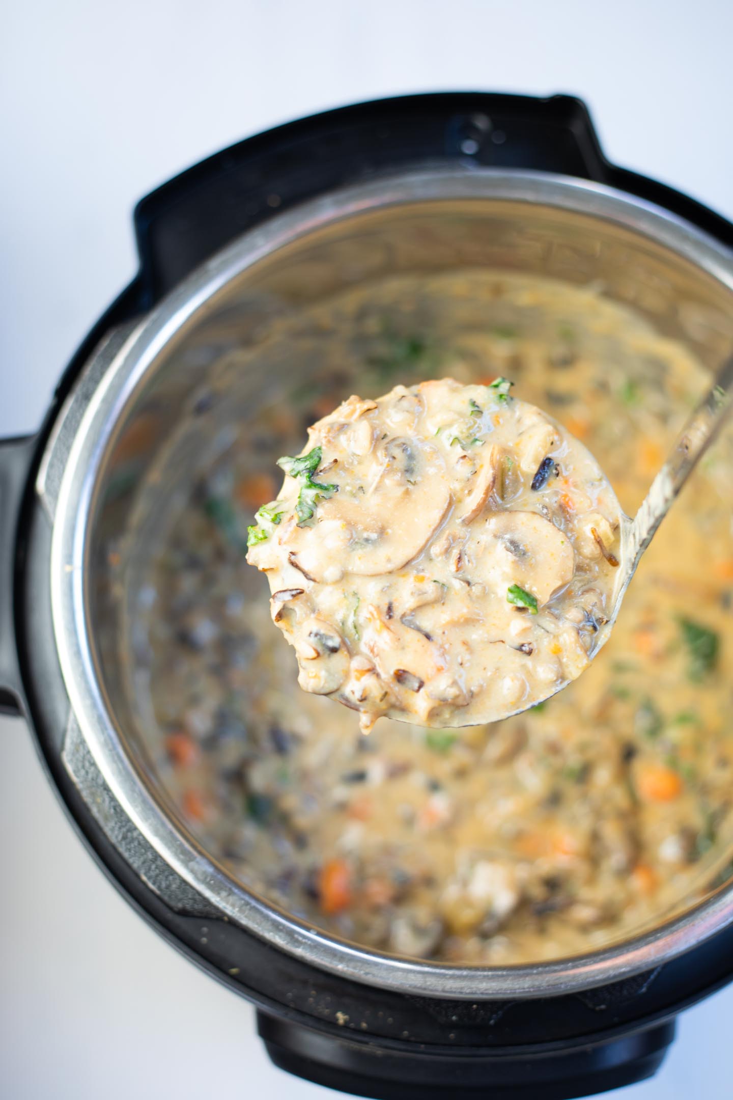Creamy soup with mushrooms and kale in the instant pot