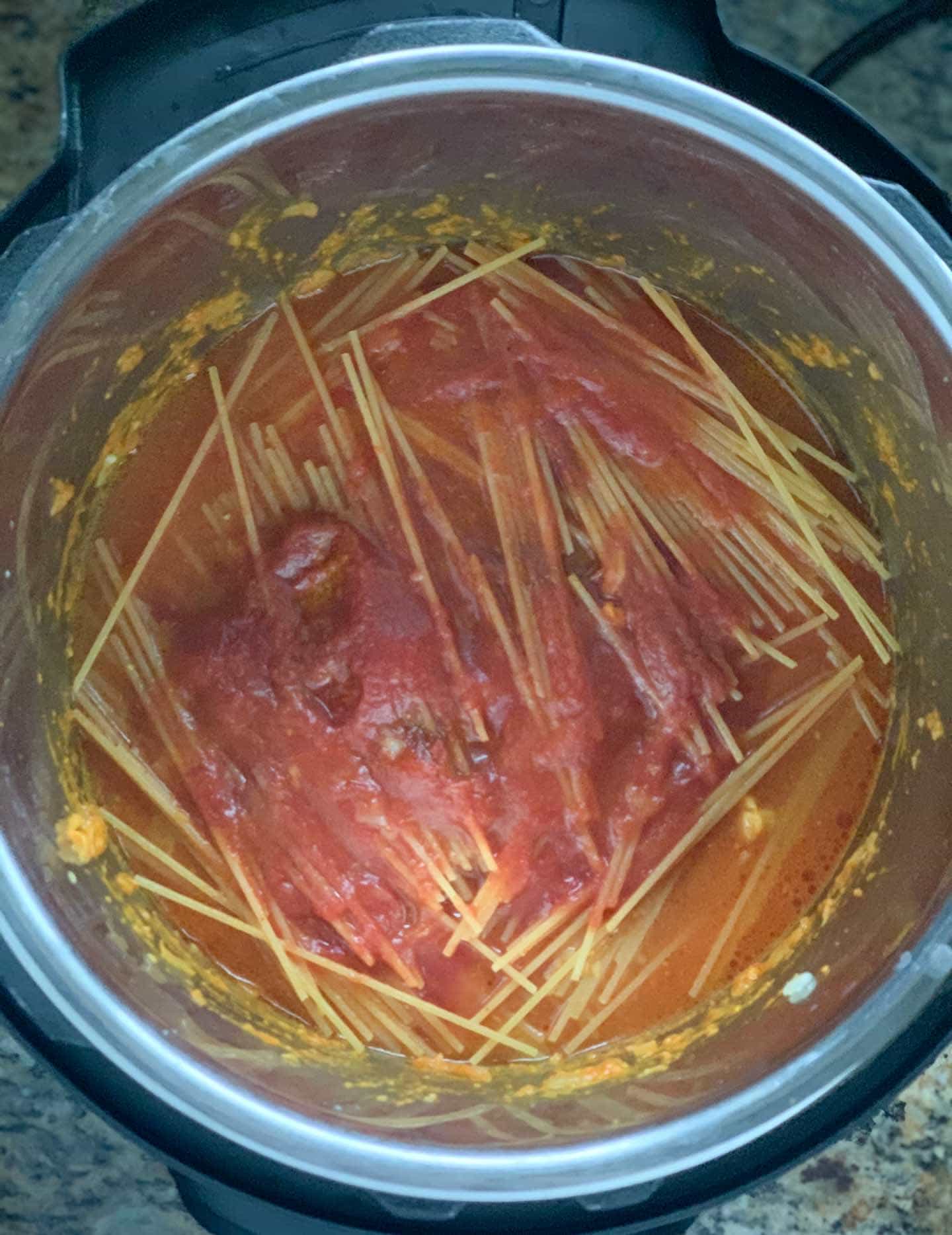 Chicken Tikka Masala Pasta Step 3 Layer pasta tomato sauce- Piping Pot Curry Spaghetti in the instant pot topped with tomato puree and water