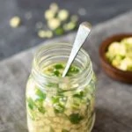 Adrak ka achar. Ginger green chili pickle in a glass bottle