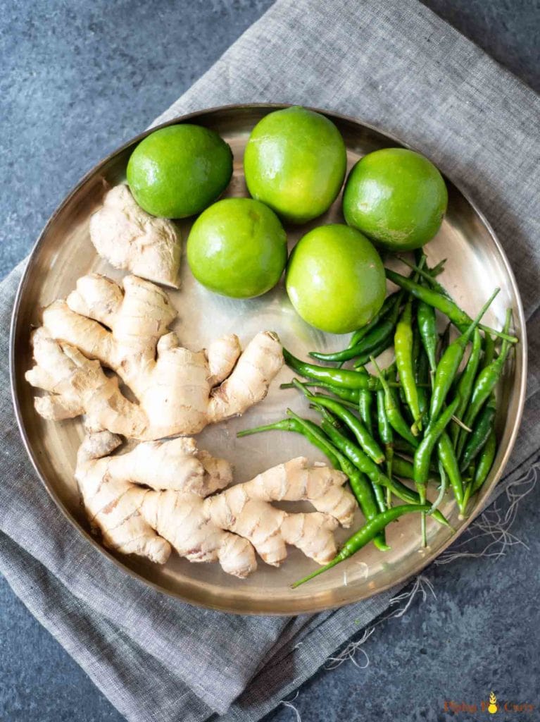 Ginger, green chili and lime in a large plate