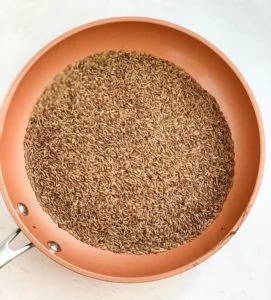 roasted cumin seeds in a pan
