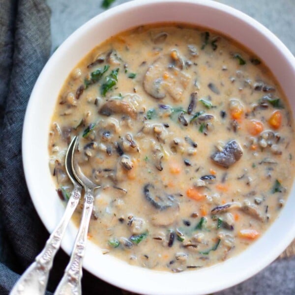 Creamy instant pot mushroom wild rice soup served in a white bowl