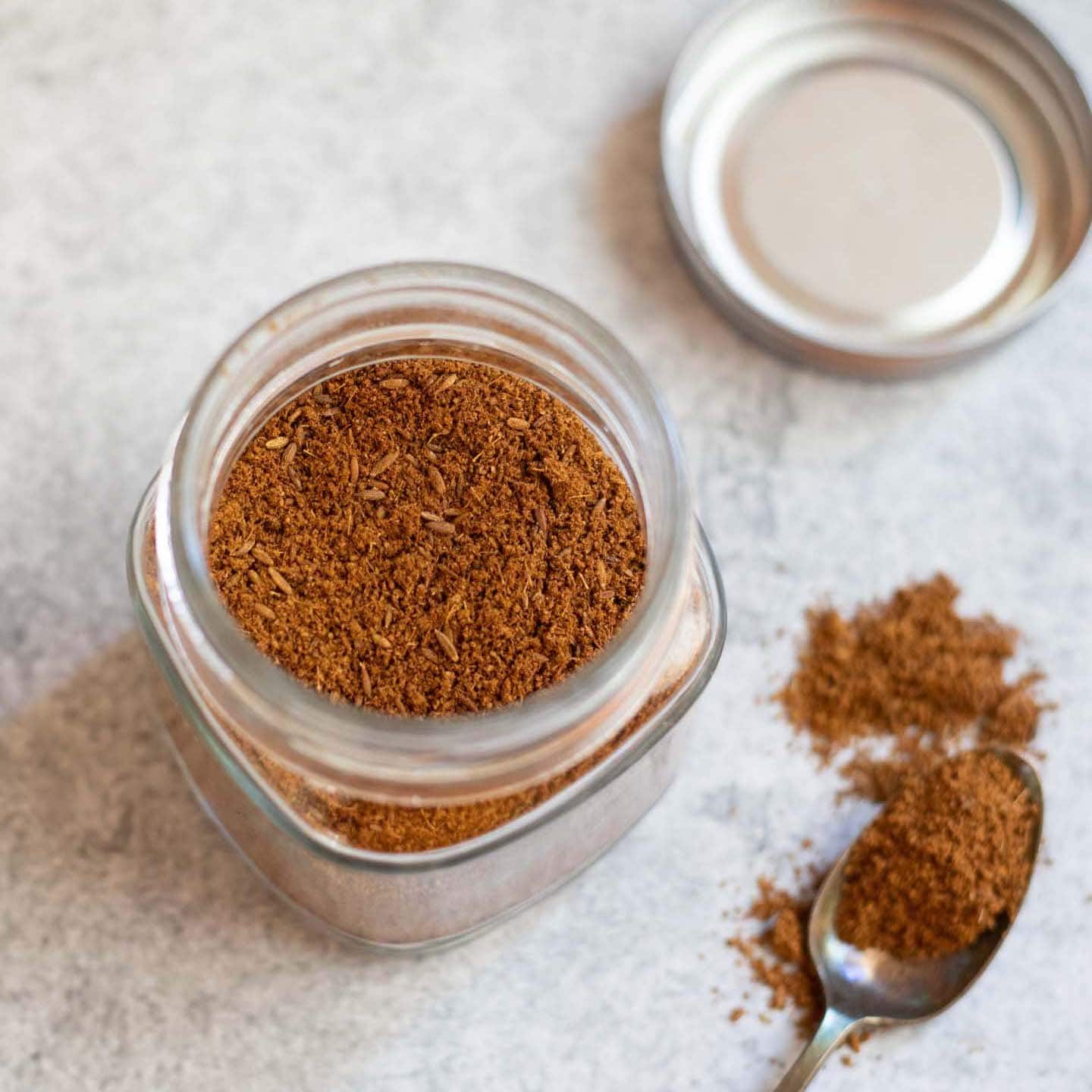 Roasted cumin powder in a glass jar