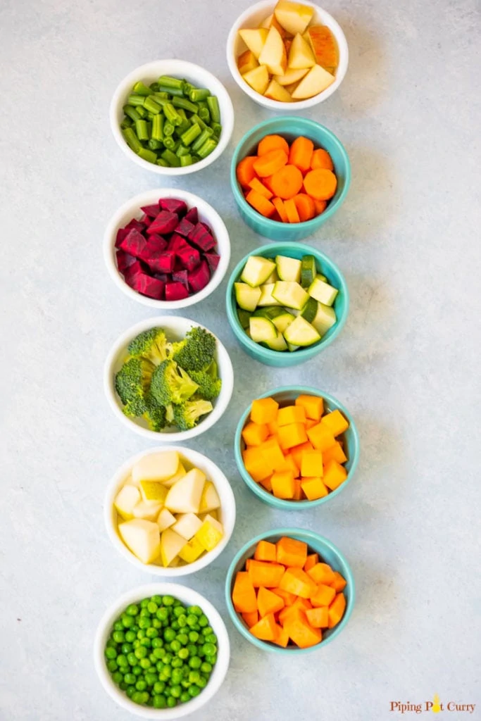 small bowls of cubed fruits and veggies 