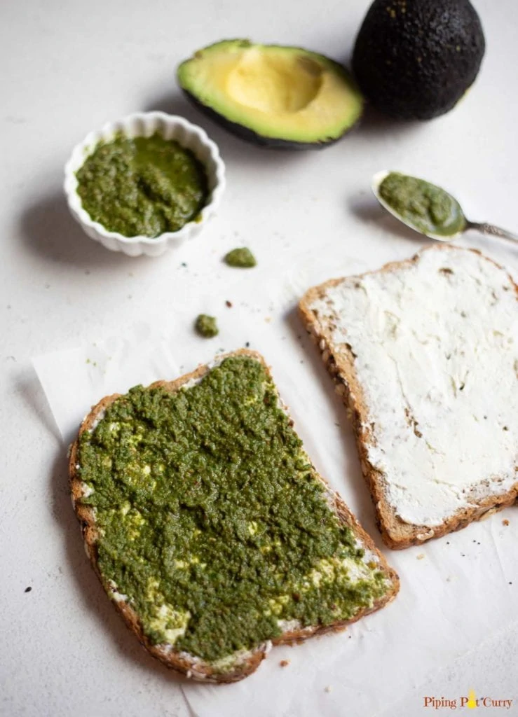 Two spices of bread with cream cheese and green chutney 