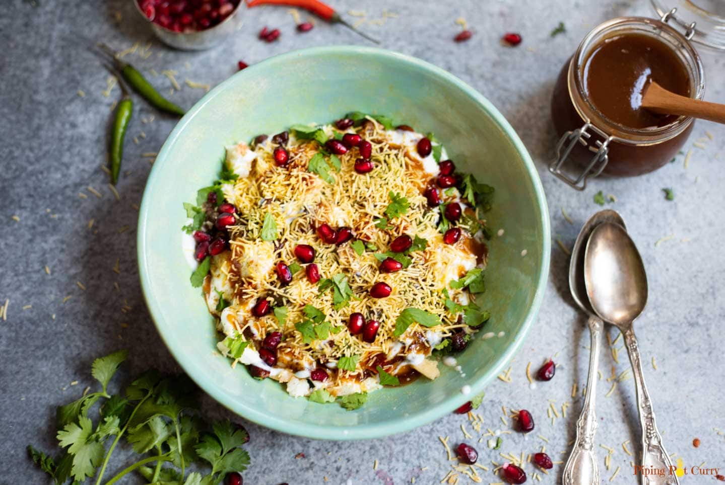 Dahi Papdi chaat in a green bowl