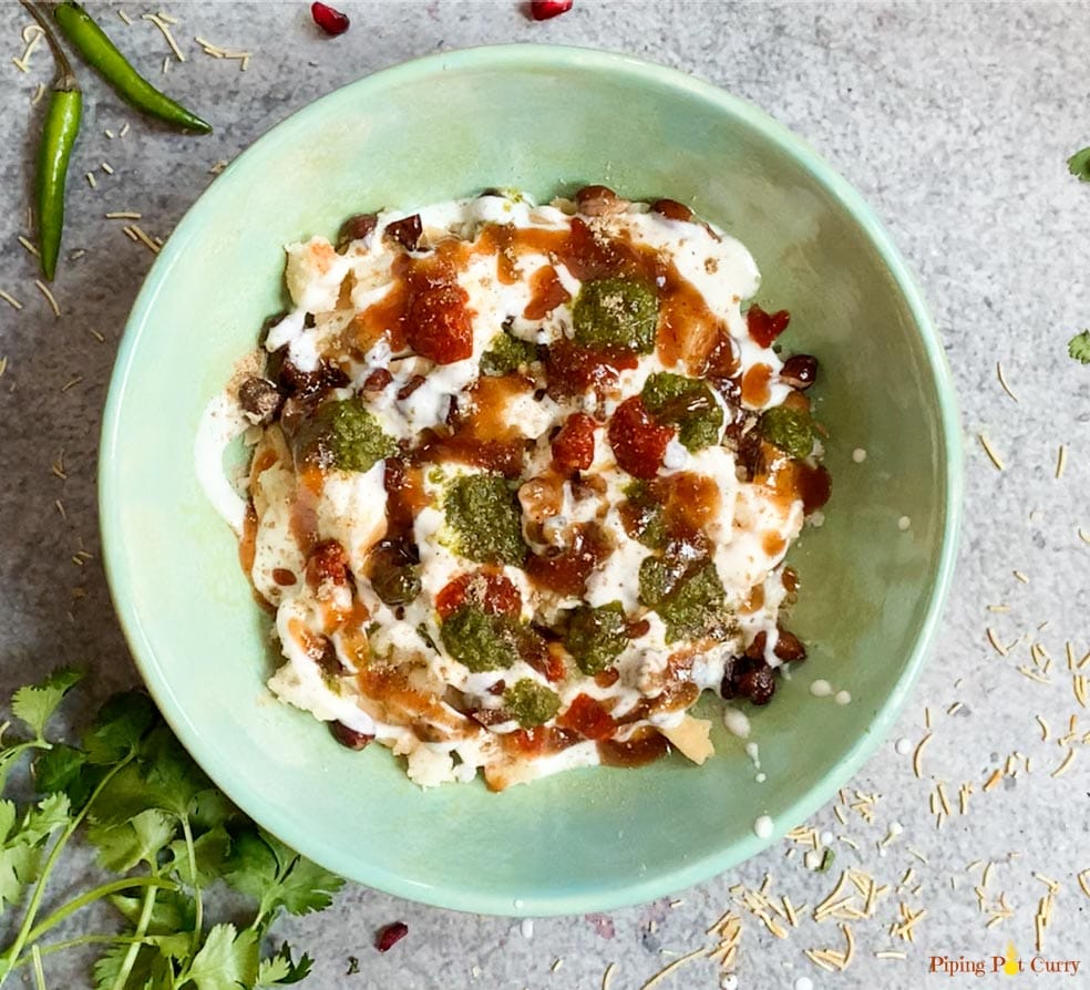 Chutneys topped on dahi papdi chaat