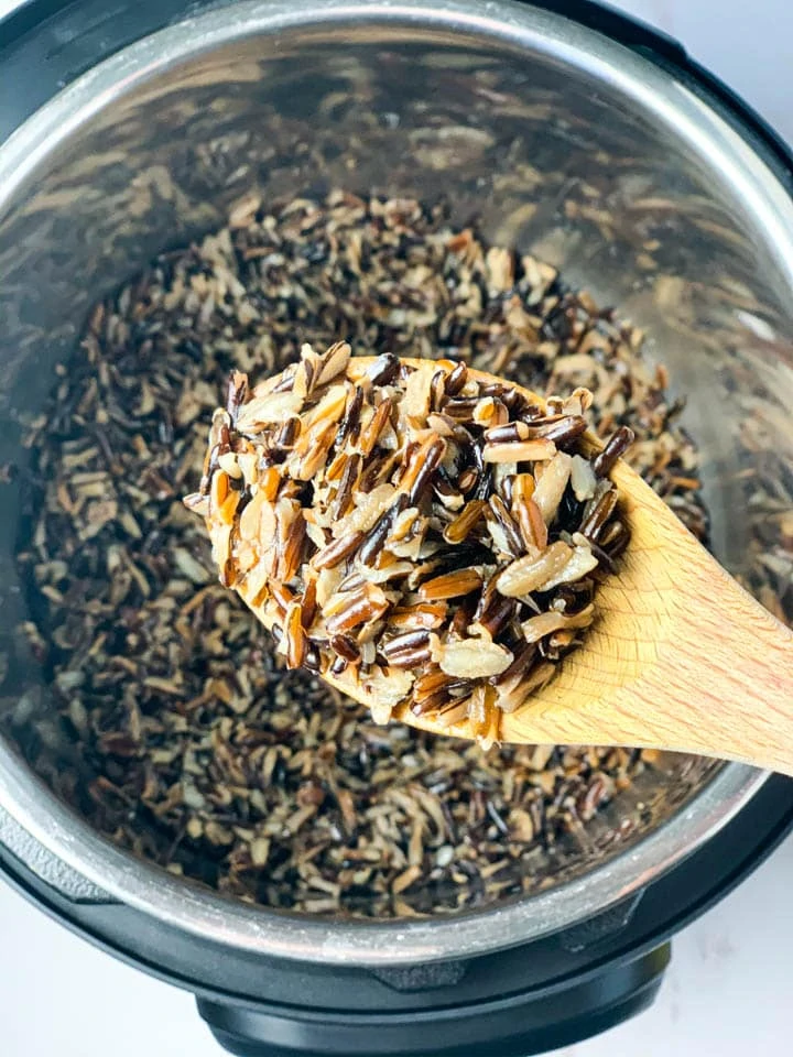 Wild rice in a ladle over the instant pot