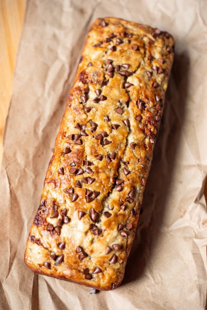 Chocolate Chip Banana Bread loaf on a brown paper 