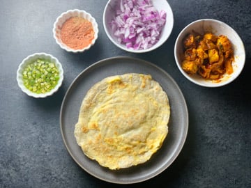 Paneer Frankie Recipe Steps - Piping Pot Curry-8 All ingredients ready around a flatbread roti to make a Frankie
