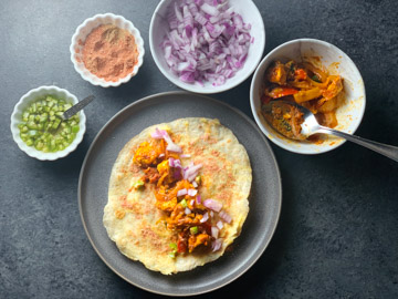 Paneer Frankie Recipe Steps - Piping Pot Curry-9 Paneer topped on a roti to make Frankie with condiments on the side
