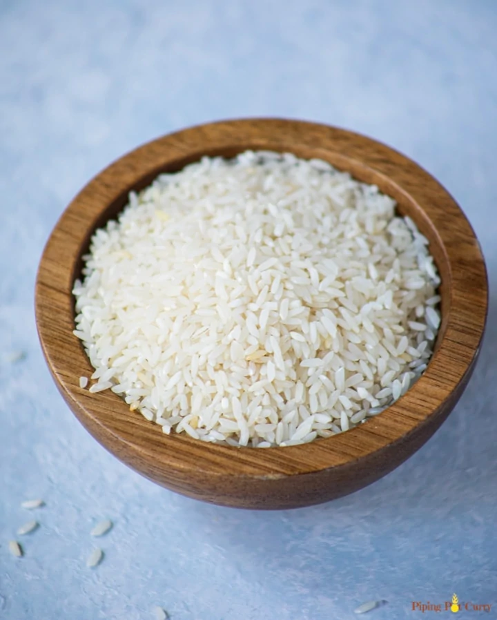 short grain Sona masoori rice in a small wood bowl 