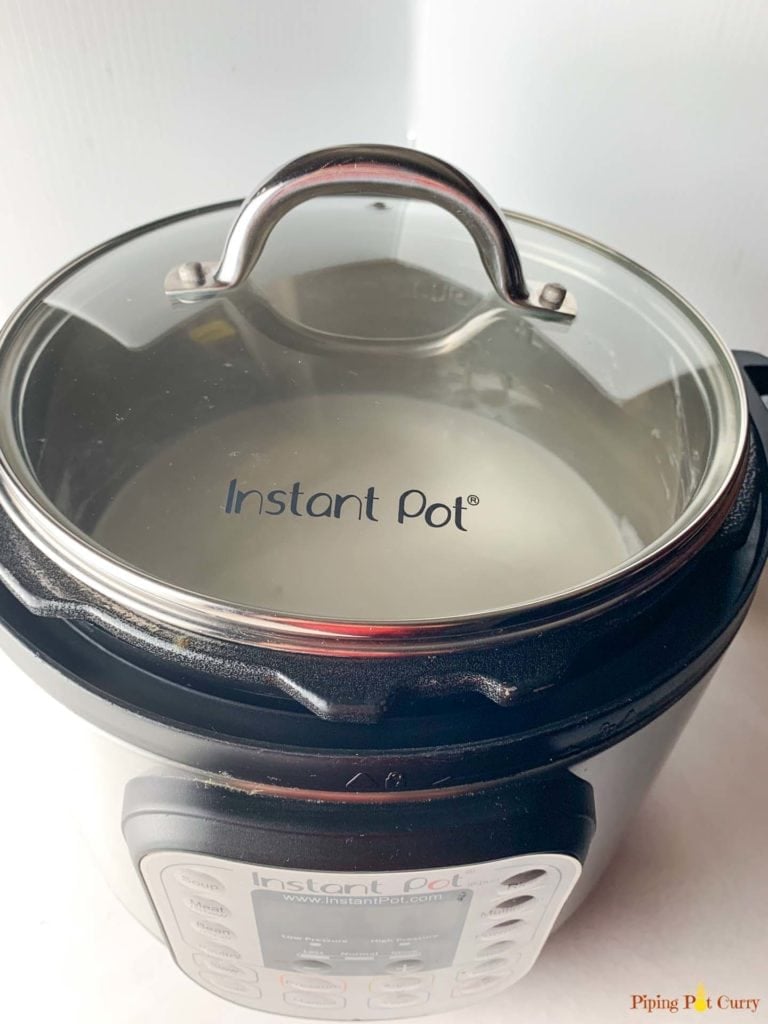 Idli Dosa Batter in instant pot covered with a glass lid 