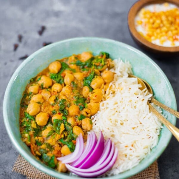Chickpea and spinach curry with white basmati rice and onions