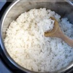 White Rice in an instant pot with a ladle