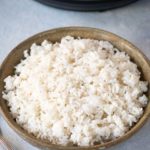 White Rice in a bowl in front of an instant pot