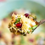 Close up of papdi chaat in a spoon