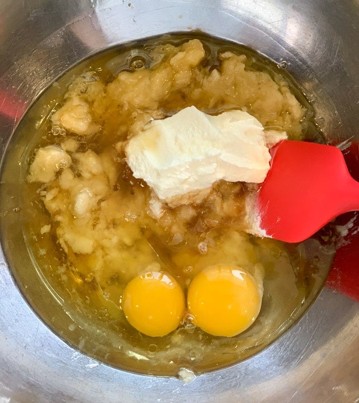 Healthy Banana Bread Steps - Piping Pot Curry-1 Ingredients to be mixed in a bowl - yogurt, eggs, mashed banana