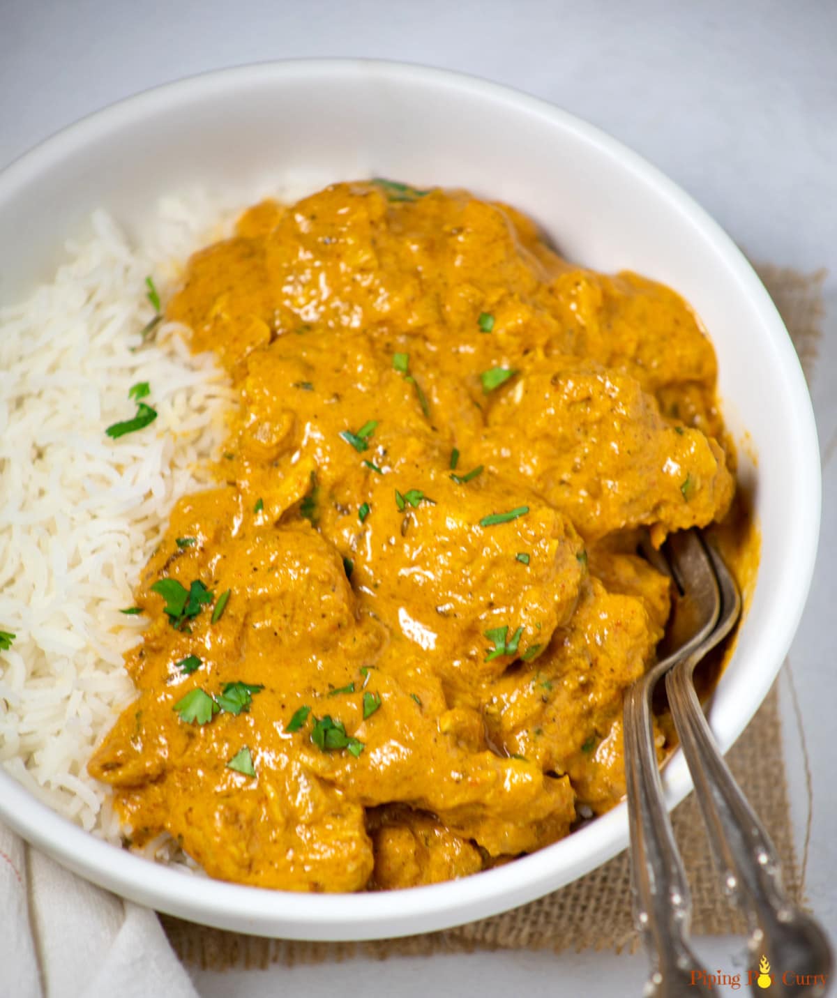 Chicken Curry with coconut milk in a white bowl