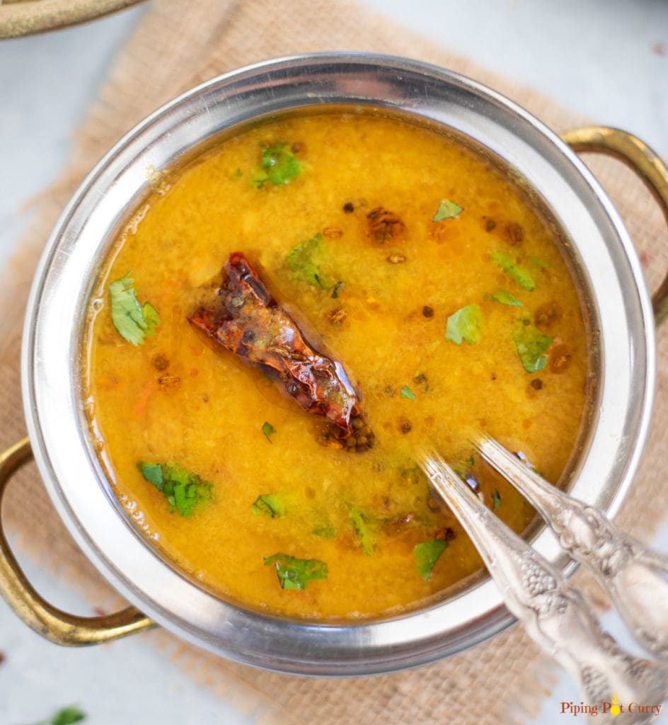 Gujarati Dal in a hand bowl garnished with cilantro