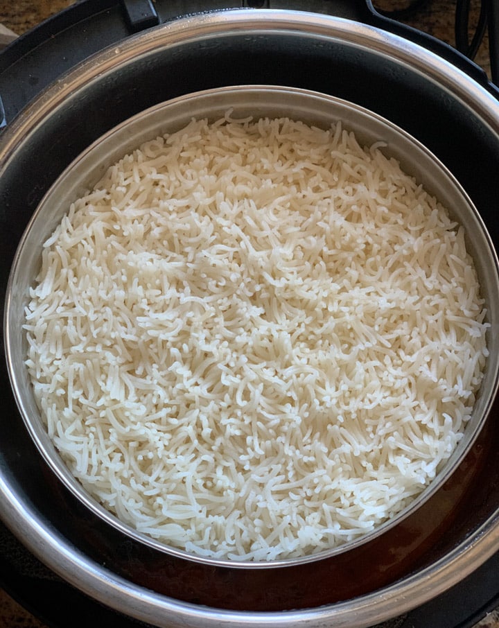 Gujarati Dal Instant Pot Steps - Piping Pot Curry-6 Rice cooked in a bowl with pot-in-pot method in instant pot.