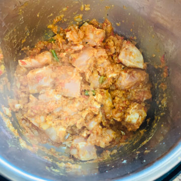 Instant Pot Chicken Potato Curry Steps - Piping Pot Curry-6 Chicken added to spiced masala curry sauce in the instant pot