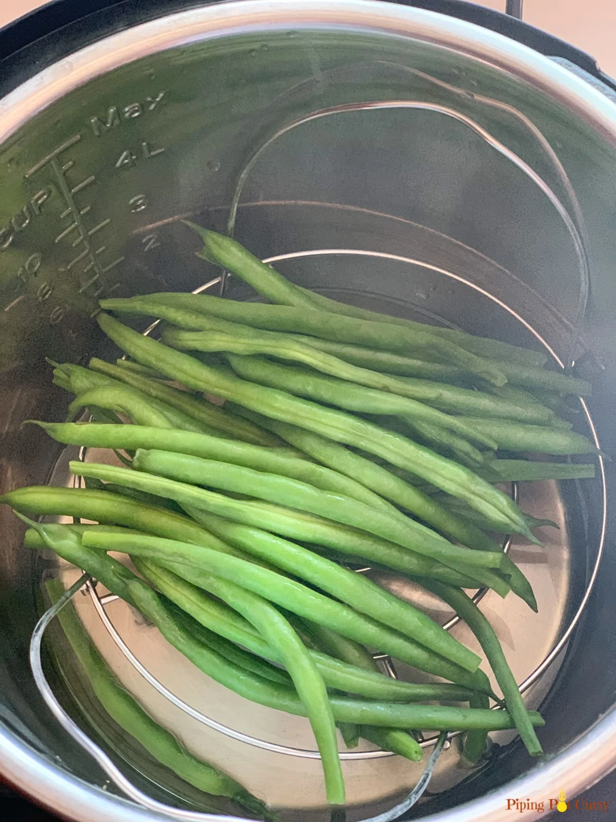 Steamed Green beans on a trivet in the instant pot